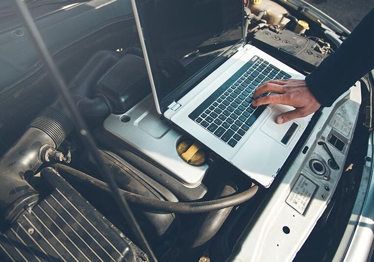 placing a tablet pc on a car to do defect checking